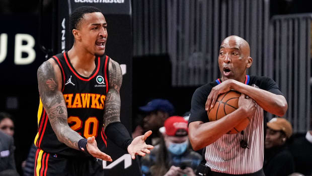 John Collins argues with an official.